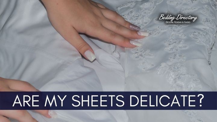lady checking to see if her bed sheets are delicate or not